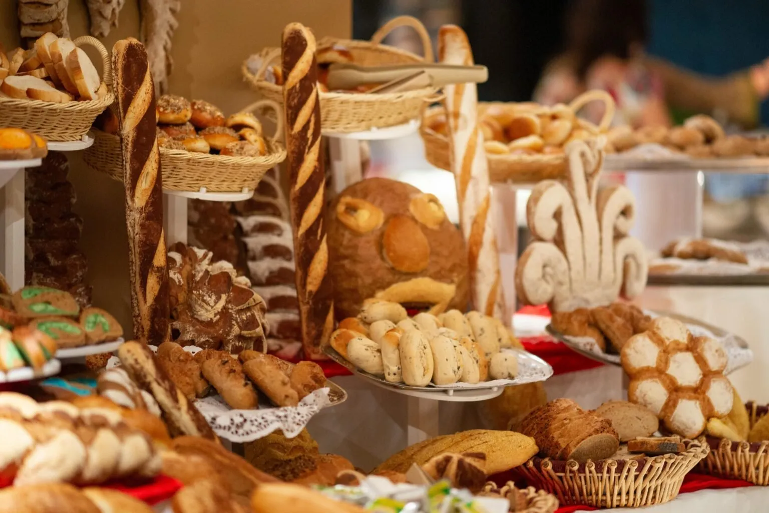 Bakery display of breads, rolls and pastries in wicker baskets
