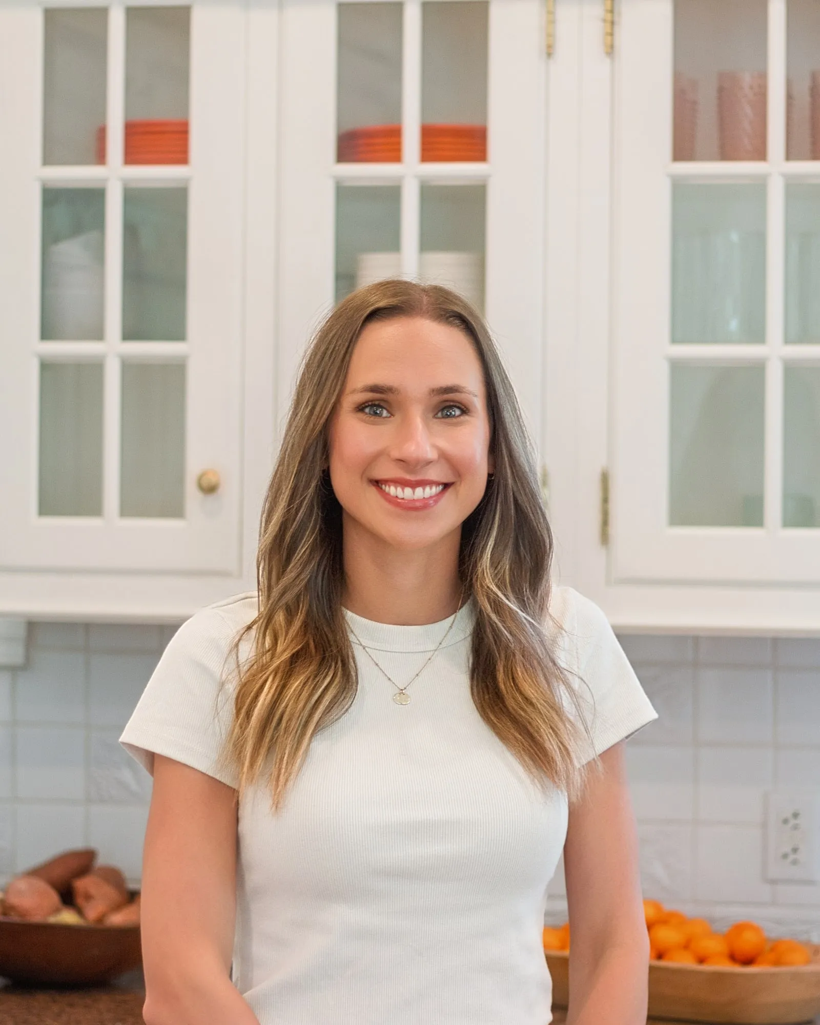Macie Fuquay, RDN, smiling in a bright kitchen