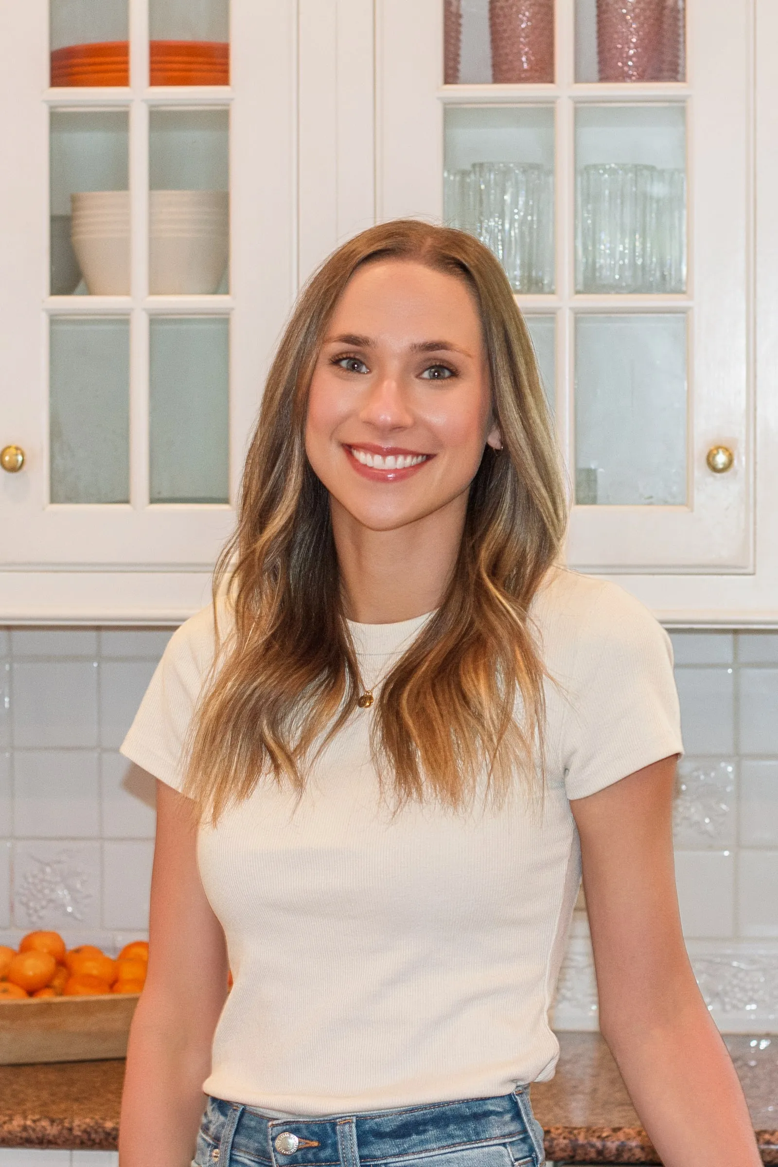 Macie Fuquay, RDN, leaning on a kitchen counter
